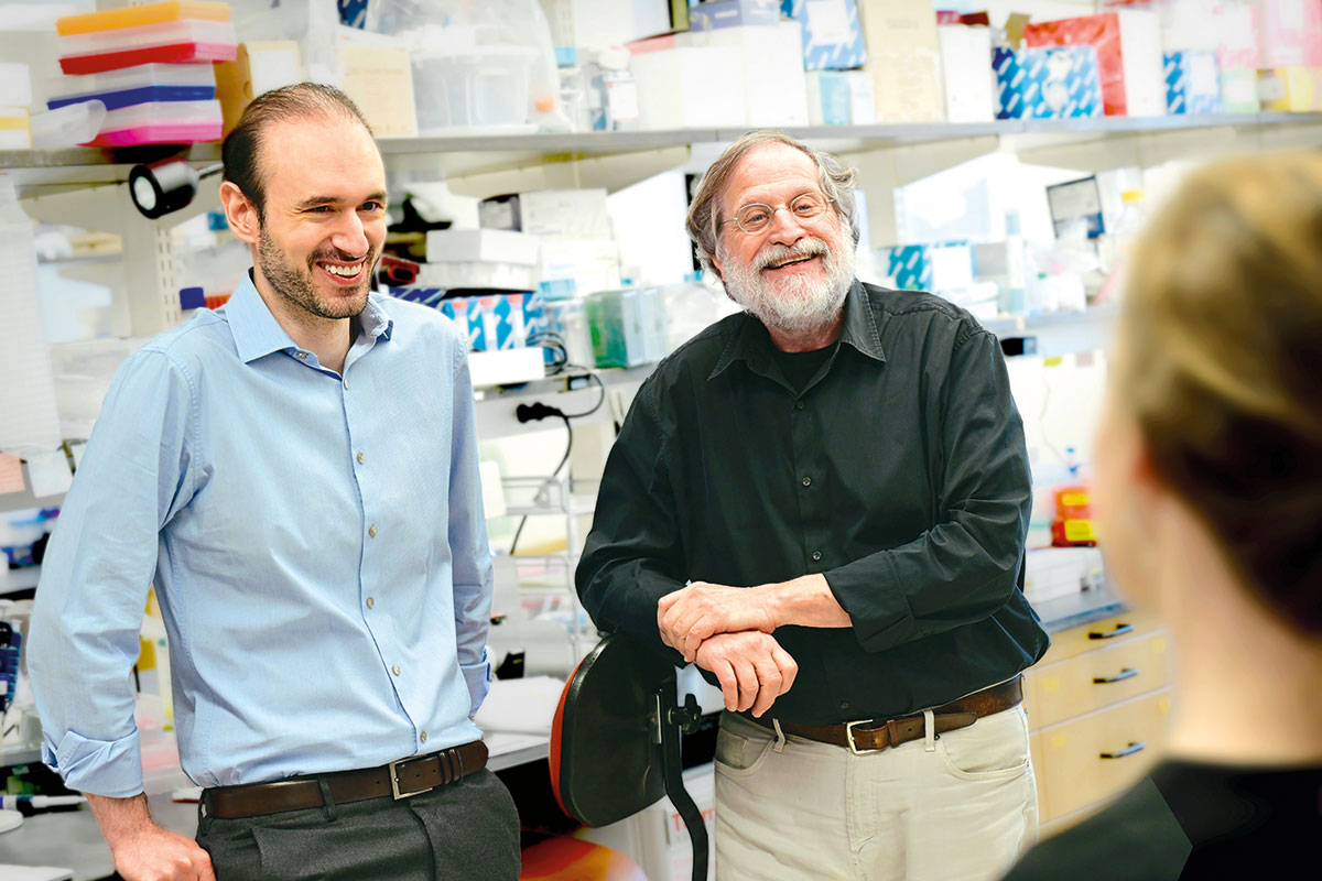 Jeff Ravetch and Stylianos Bournazos in conversation in the lab.