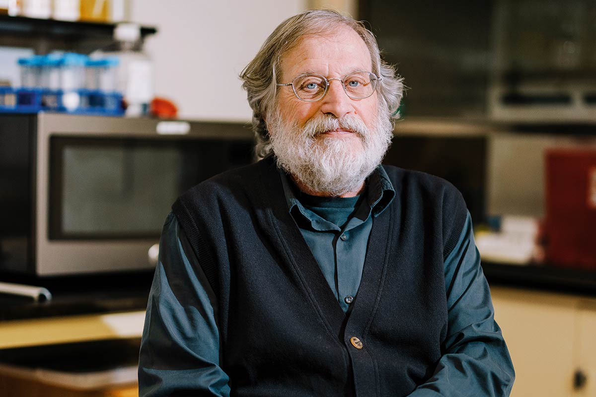 Portrait of Ravetch in a lab